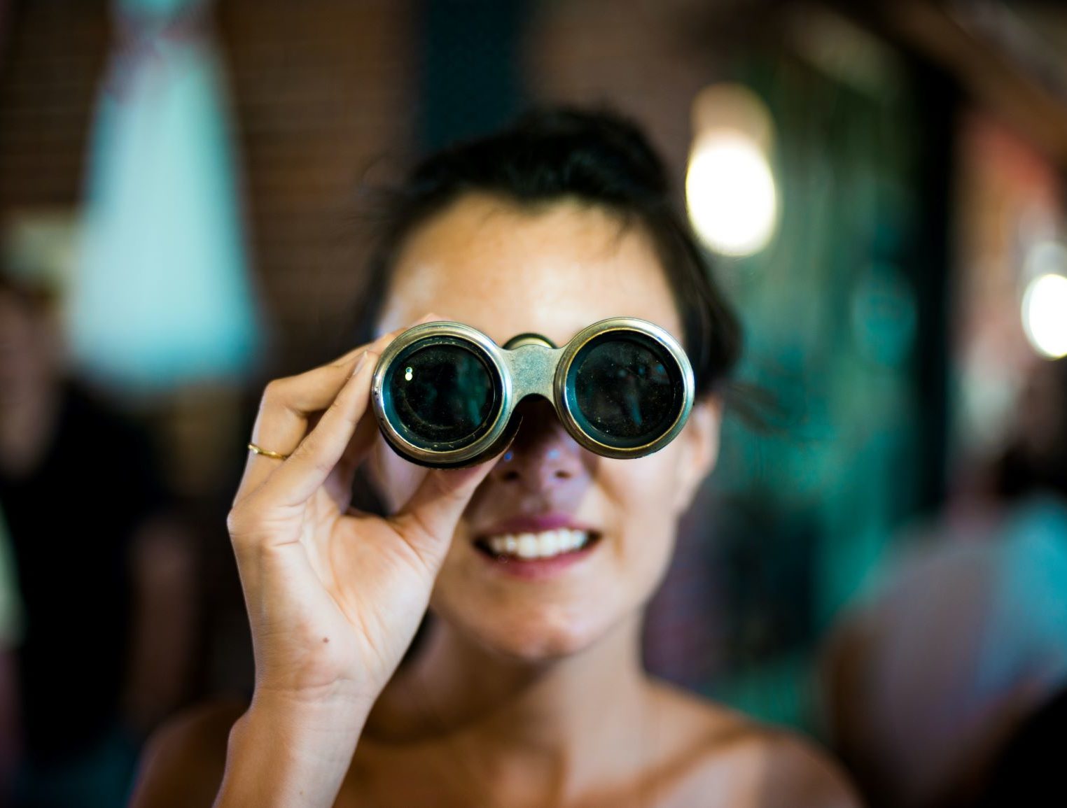 woman peering at something in the distance